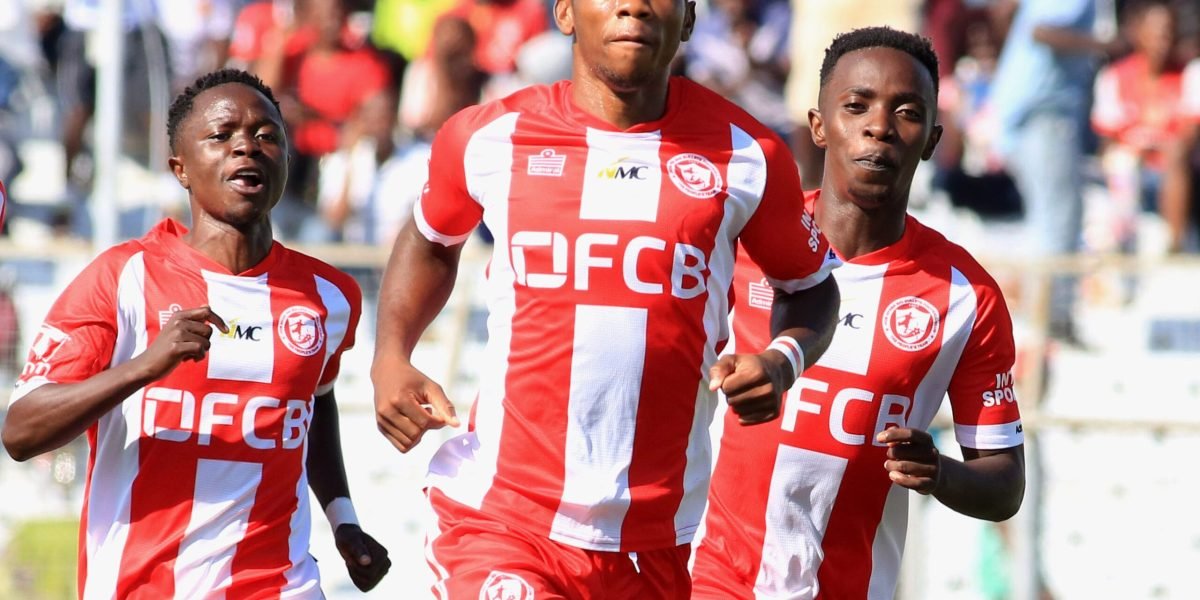 Alick Lungu is joined by Mike Mkwate and Patrick Mwaungulu as he celebrates his stunner against MAFCO in the TNM Super League at Kamuzu Stadium