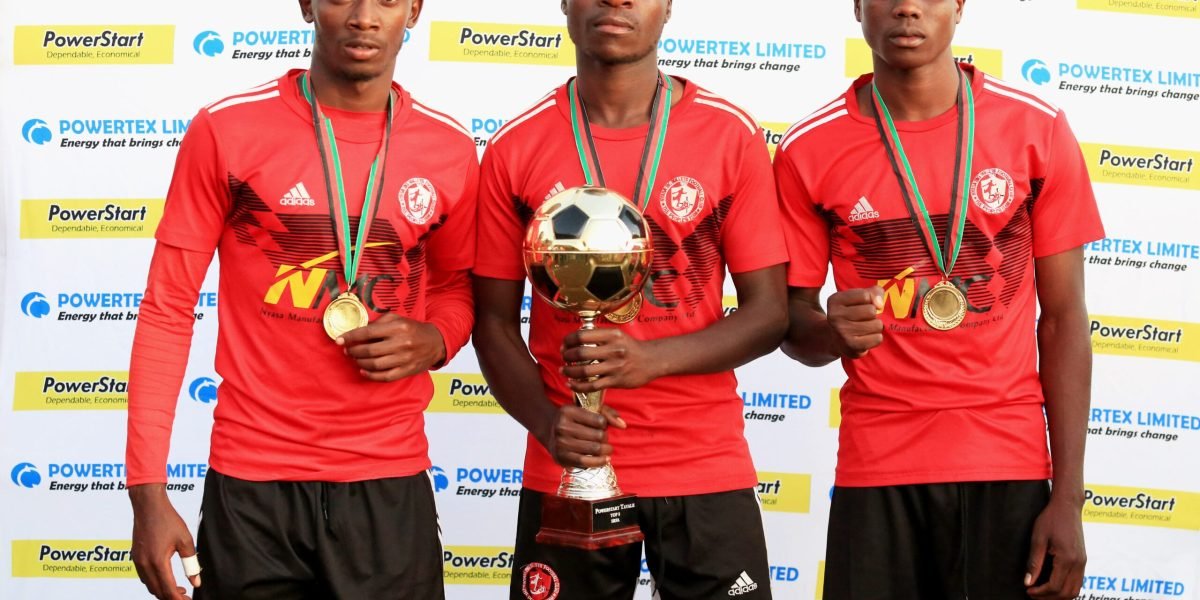 Chikumbutso Salima, Emmanuel Saviel and Chrispine Mapemba pose with the Powerstart Tayale Cup