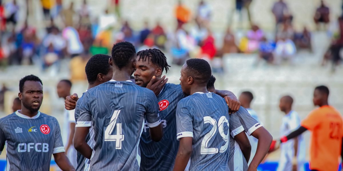 Ephraim Kondowe (centre) celebrates with teammates after opening the scoring against Kamuzu Barracks in the FDH Bank Cup quarterfinal at Kamuzu Stadium
