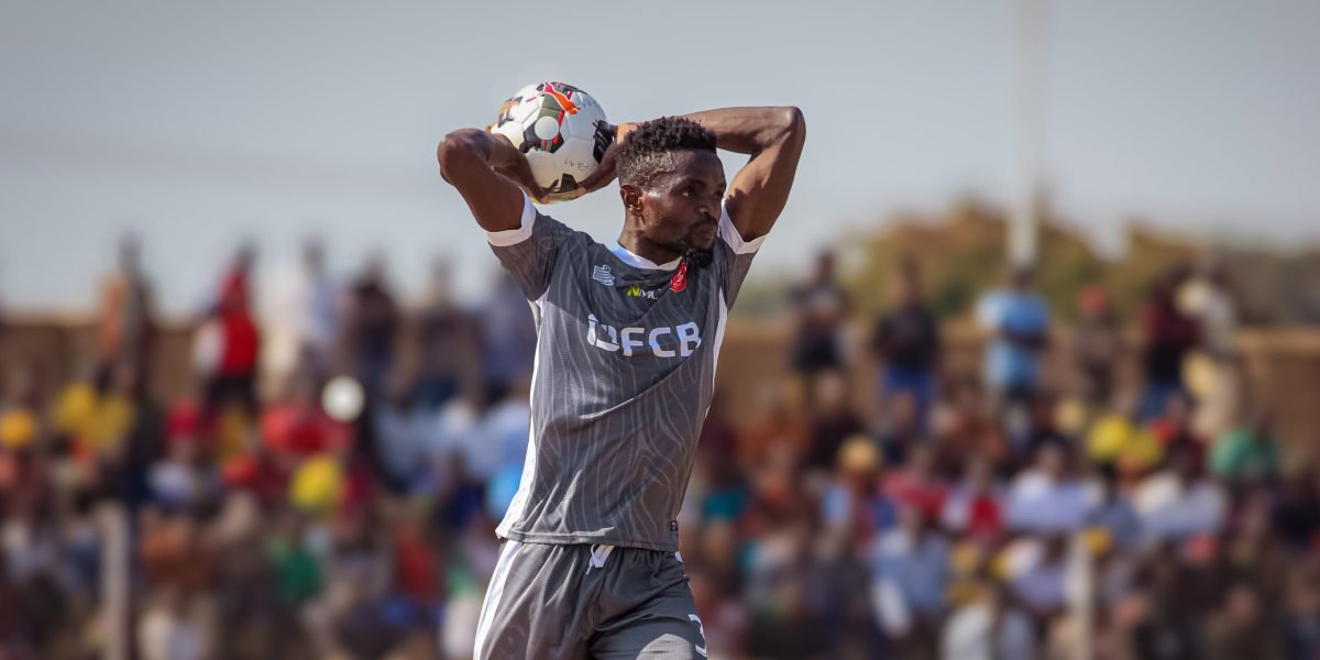 Eyes on the game! Defender Khumbo Banda delivers a throw-in on his FCB Nyasa Big Bullets debut. copy