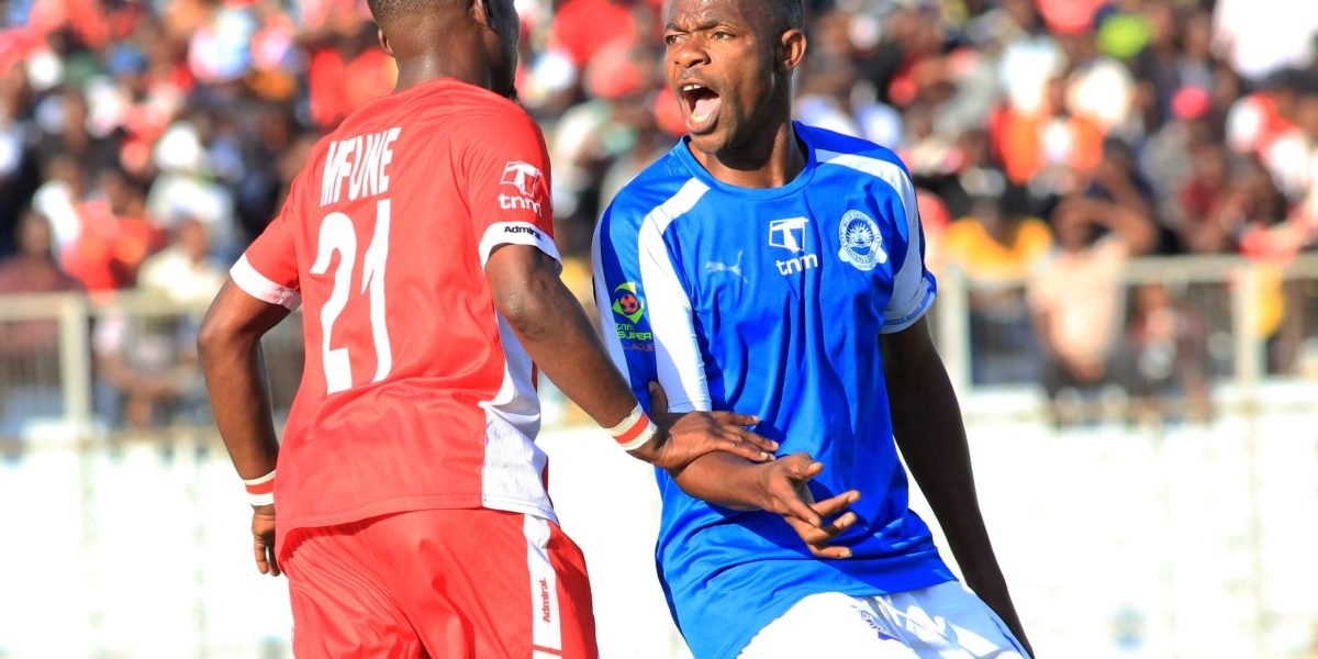 FCB Nyasa Big Bullets' Anthony Mfune and Blue Eagles defender Sankhani Mkandawire during the first round clash at Kamuzu Stadium