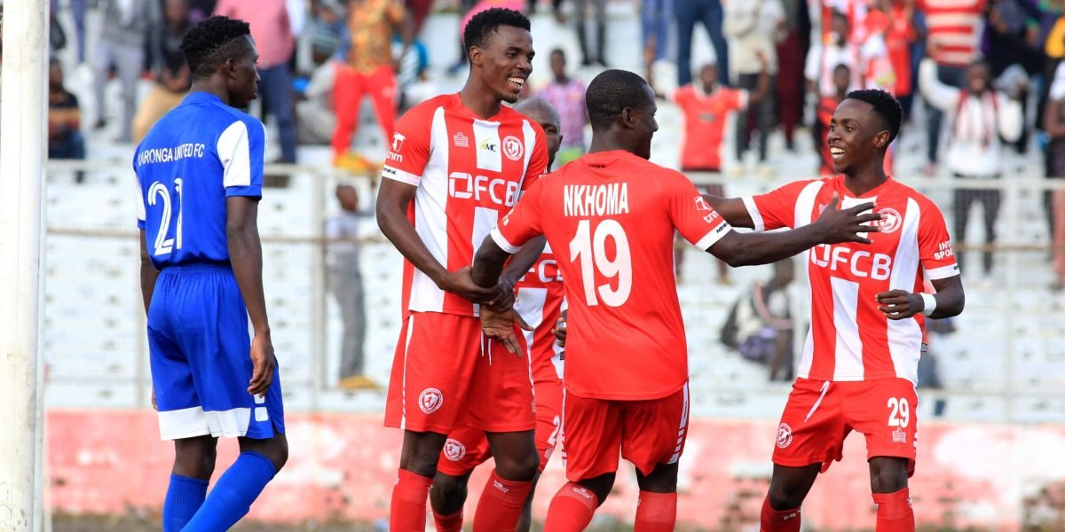 FCB Nyasa Big Bullets' Hassan Kajoke, Lanjesi Nkhoma and Patrick Mwaungulu celberating the no.19's goal against Karonga United in the TNM Super League