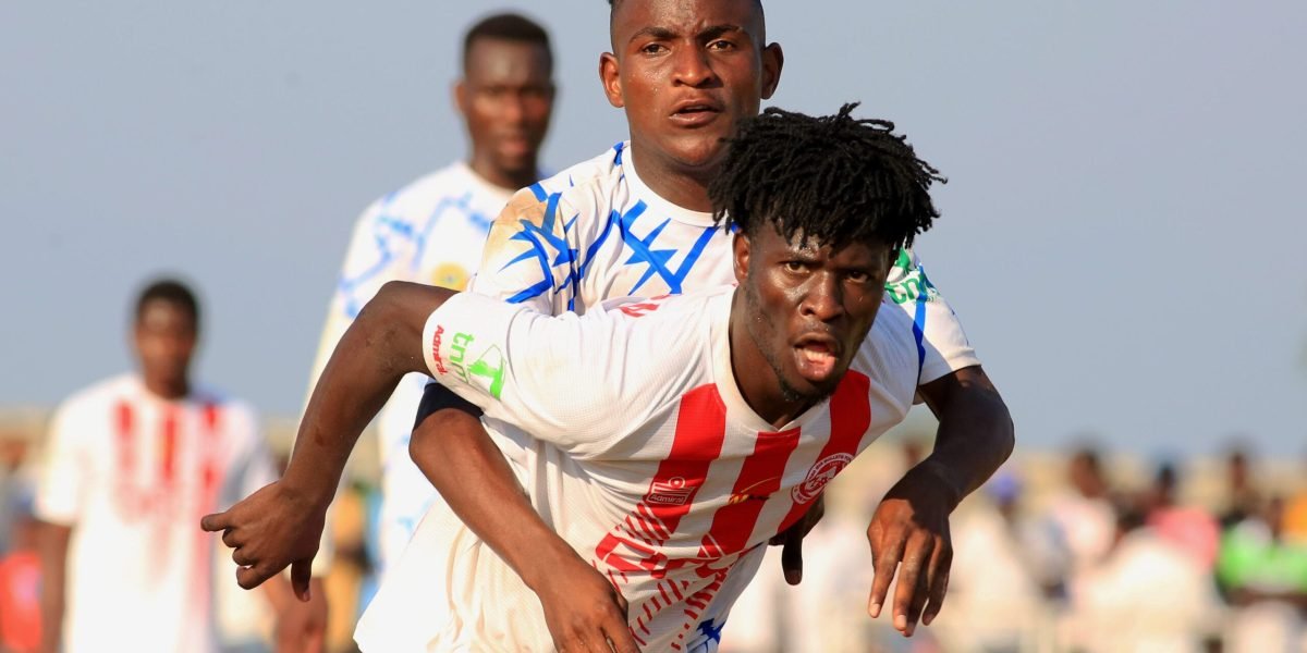 FCB Nyasa Big Bullets' Lloyd Aaron challenged by Casto Kayuni of Karonga United