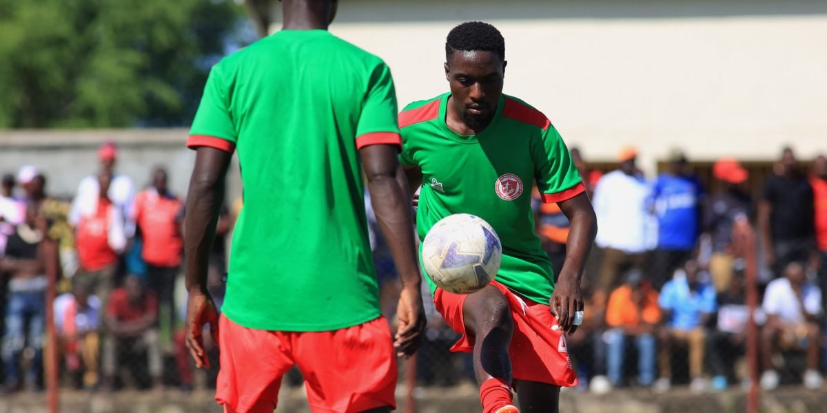 FCB Nyasa Big Bullets' Precious Phiri and Nickson Nyasulu captured at Karonga Stadium warming up for a previous TNM Super League encounter