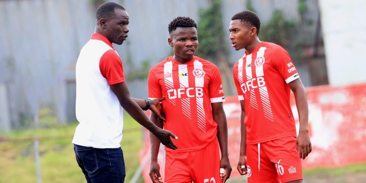 FCB Nyasa Big Bullets Reserves coach Heston Munthali with his players Kondwani Tebulo and Zaneel Jussab
