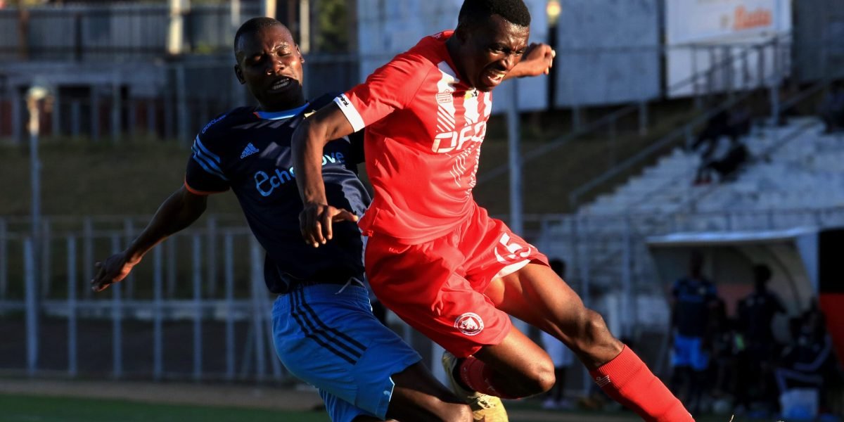 FCB Nyasa Big Bullets Reserves forward Gift Lamowa challenged by Nyambadwe United defender during the 1-1 draw in the ThumbsUp SRFL at Kamuzu Stadium