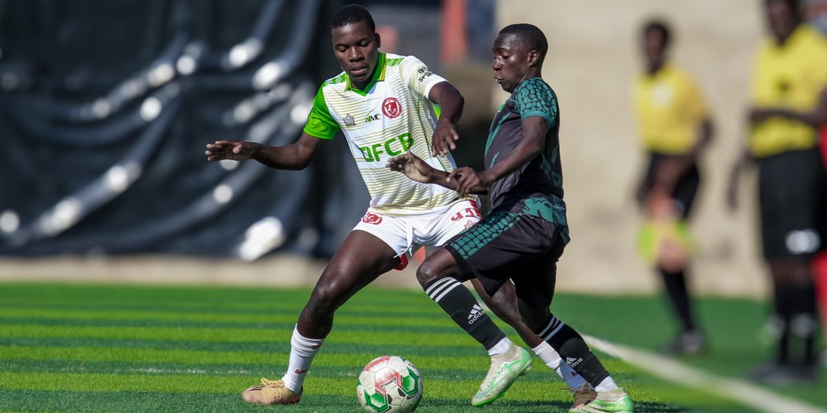 FCB Nyasa Big Bullets U17 defender Prince Jamali battles for the ball with Emerson Mulenga of Kafue Celtic Under 17
