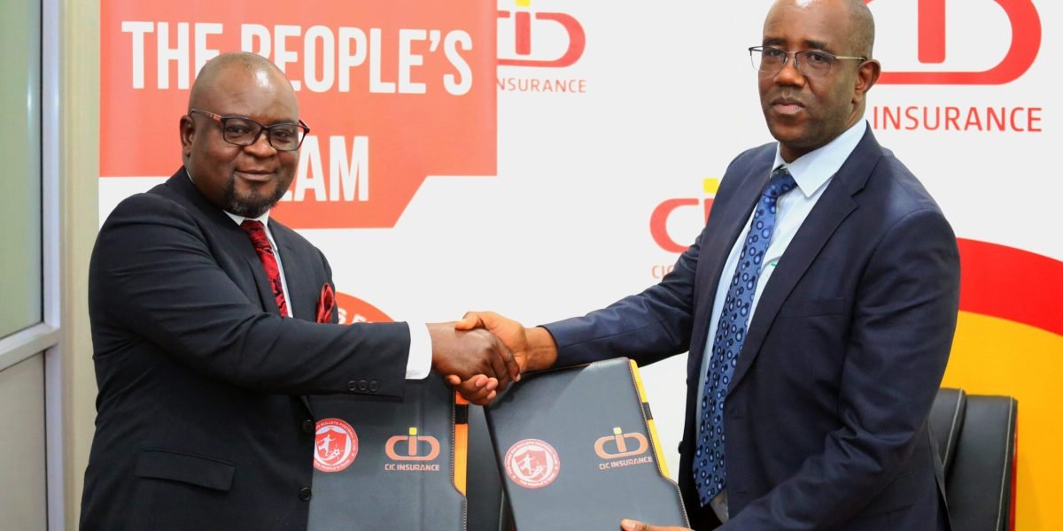 FCB Nyasa Big Bullets acting CEO Albert Chigoga and CIC Africa managing director Zackary Wambugu exchanging the agreement. Photo by Bullets Media