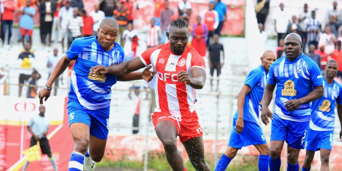 FCB Nyasa Big Bullets and Mighty Wanderers legends Tizgowere Kumwenda and James Sangala battle for the ball during the Blantyre derby legends match in 2023