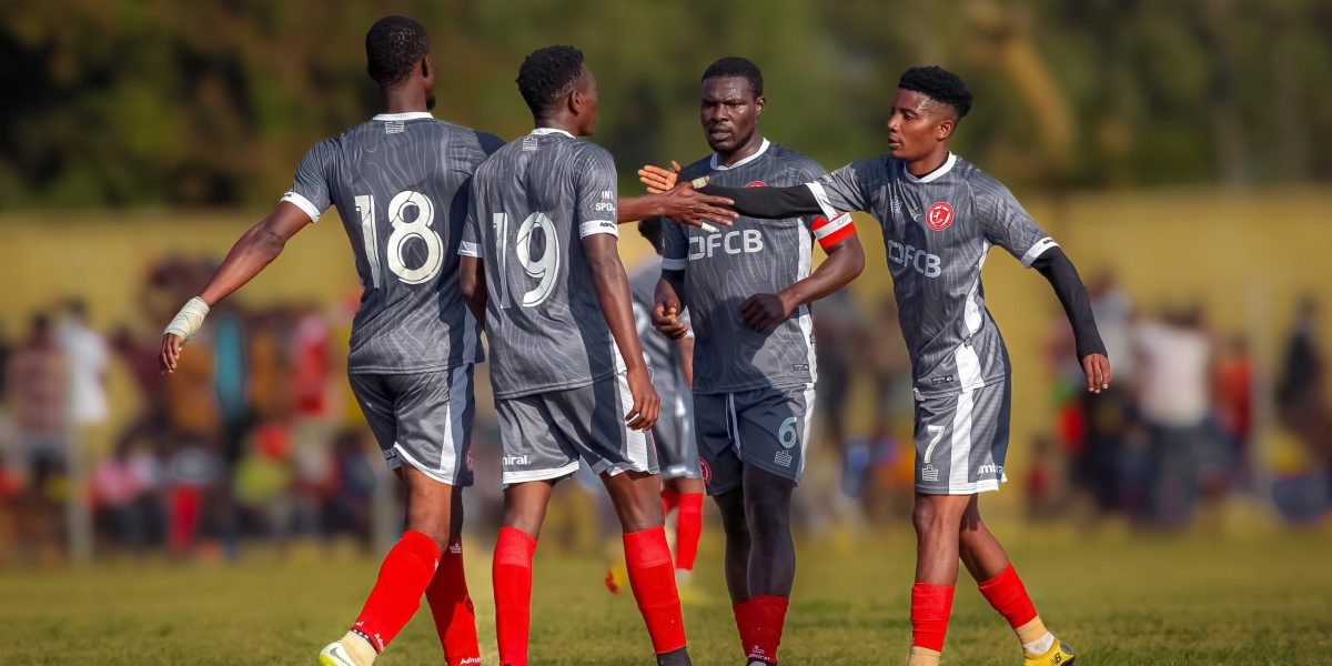 FCB Nyasa Big Bullets celebrate together after cruising to a 5-0 victory over Chilumba Barracks in the FDH Bank Cup Round of 16 at Chitipa Stadium on Sunday afternoon. copy