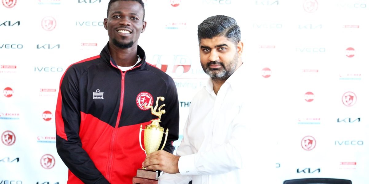 FCB Nyasa Big Bullets forward Babatunde Adepoju receiving his April HTD Player of the Month award from Ziyaad Sidik