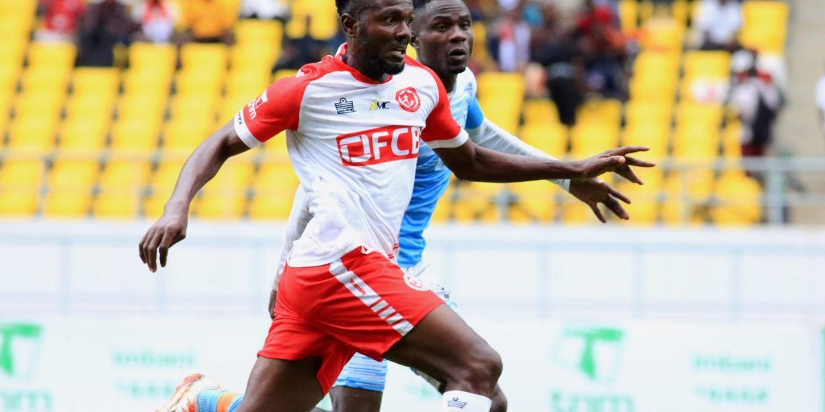FCB Nyasa Big Bullets forward Chinedu Okafor against Silver Strikers defender Nickson Mwase in the opening match of the 2023 TNM Super League