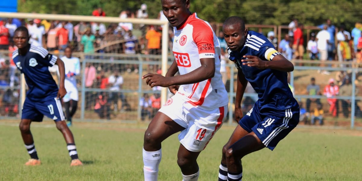FCB Nyasa Big Bullets forward Lanjesi Nkhoma beats Blue Eagles' Gilbert Chirwa as the two sides drew 0-0 in the TNM Super League at Nankhaka Stadium