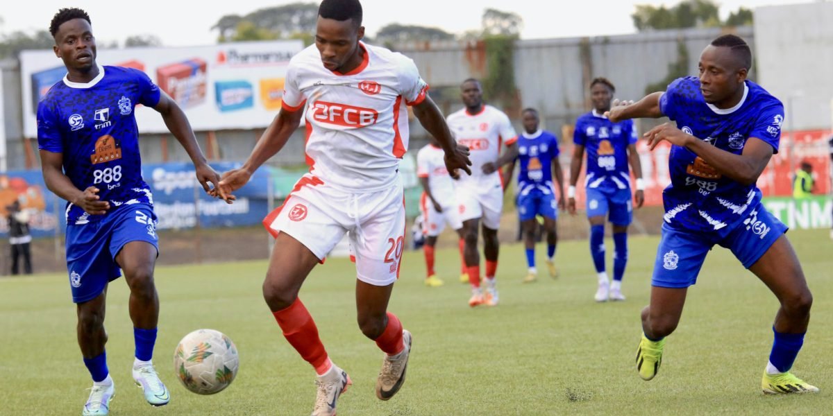 FCB Nyasa Big Bullets forward Maxwell Phodo in action against Mighty Wanderers' Gaddie Chirwa and Timothy Silwimba