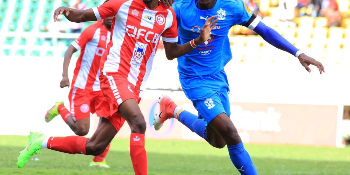 FCB Nyasa Big Bullets forward Maxwell Phodo in the thick of things against Mighty Mukuru Wanderers defender Lawrence Chaziya in the 2023 NBS Bank Charity Shield