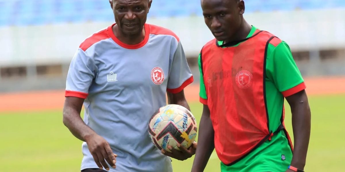 FCB Nyasa Big Bullets head coach Kalisto Pasuwa with forward Lanjesi Nkhoma