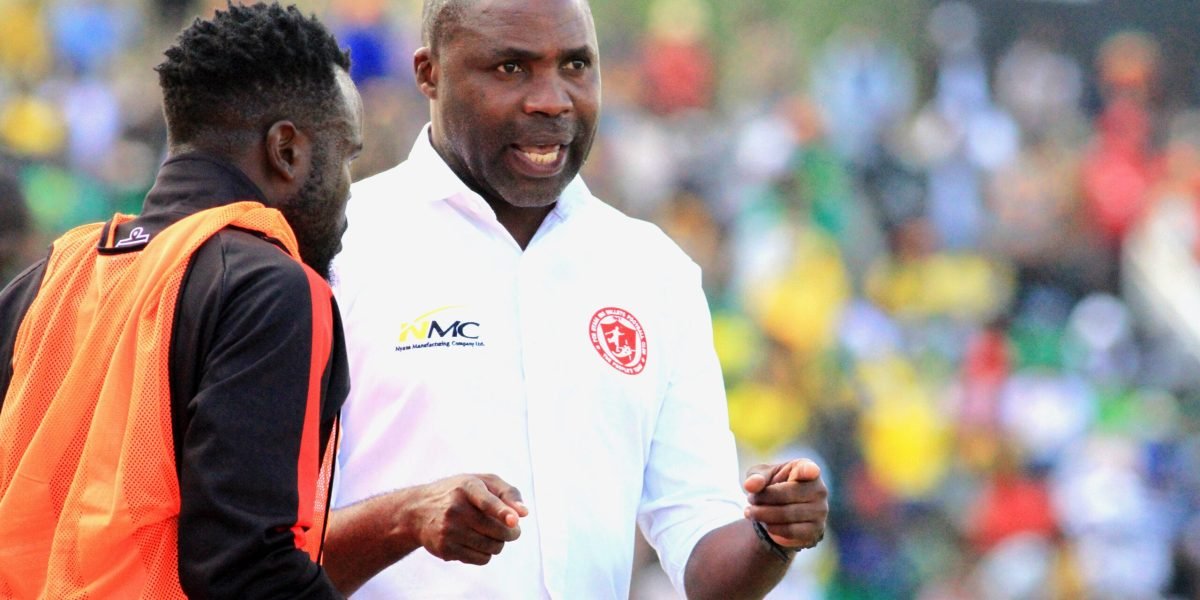 FCB Nyasa Big Bullets head coach Peter Mponda providing instructions to Paul Master