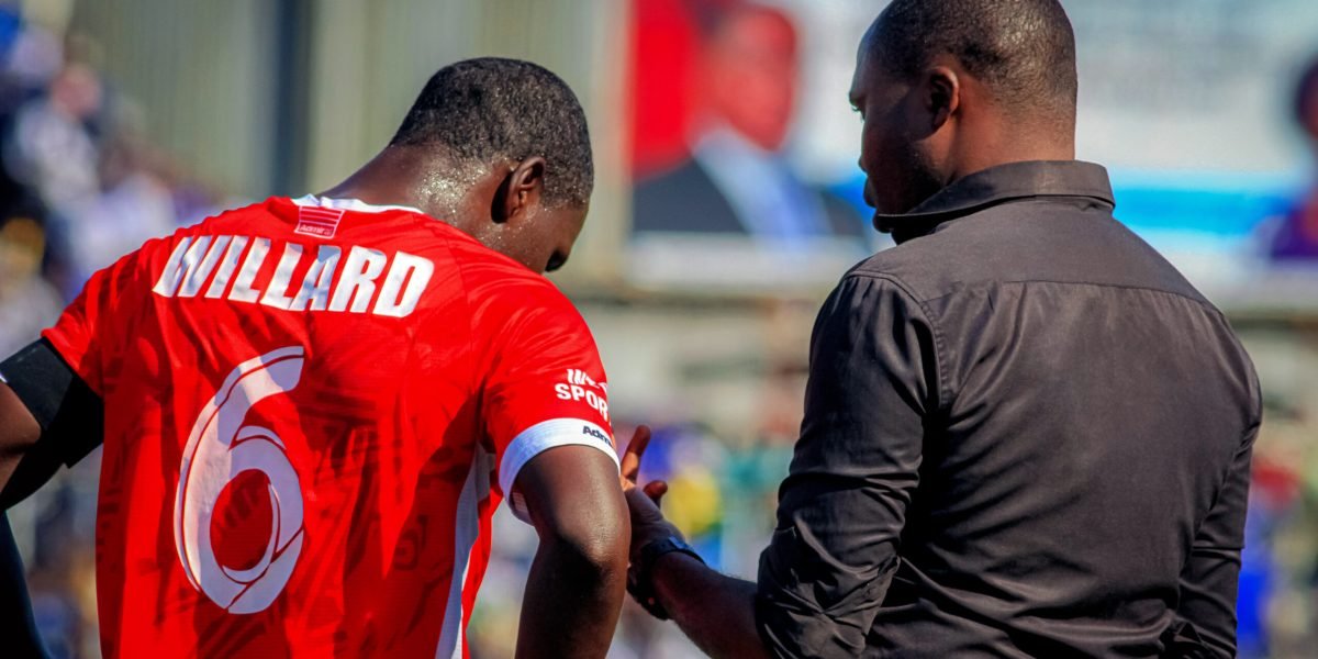 FCB Nyasa Big Bullets head coach Peter Mponda talking to captain Frank Willard during the Blantryre derby in the TNM Super Leagu copy
