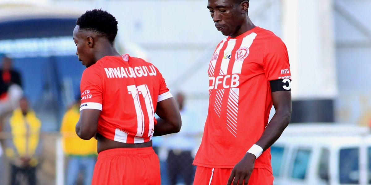 FCB Nyasa Big Bullets midfielder Patrick Mwaungulu and captain Precious Sambani