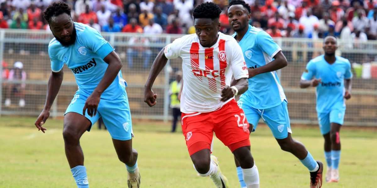 FCB Nyasa Big Bullets midfielder Stanley Billiat takes on Silver Strikers midfielder Chikondi Kamanga