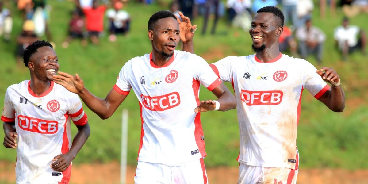 FCB Nyasa Big Bullets number 20 Maxwell Phodo is joined by Mike Mkwate and Babatunde Adepoju in celebrating his goal against Creck Sporting Club
