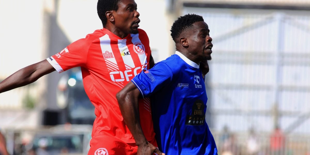 FCB Nyasa Big Bullets vice captain Gomegzani Chirwa battling against Mighty Mukuru Wanderers midfielder Gaddie Chirwa in the first round of the 2024 TNM Super League