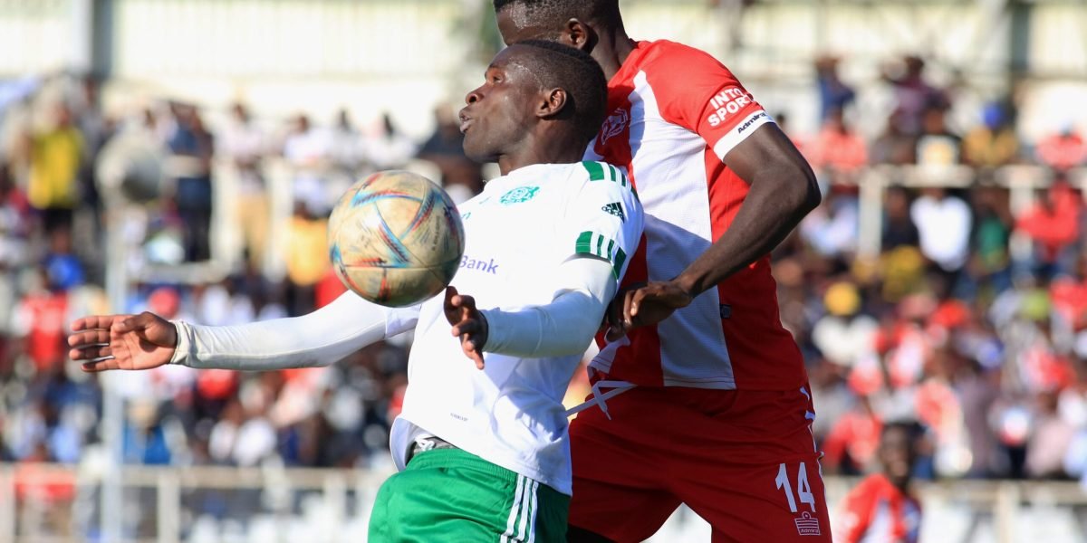 Mafco's Mphatso Phillimon challenged by FCB Nyasa Big Bullets defender Clyde Senaji in the first round TNM Super League match at Kamuzu Stadium