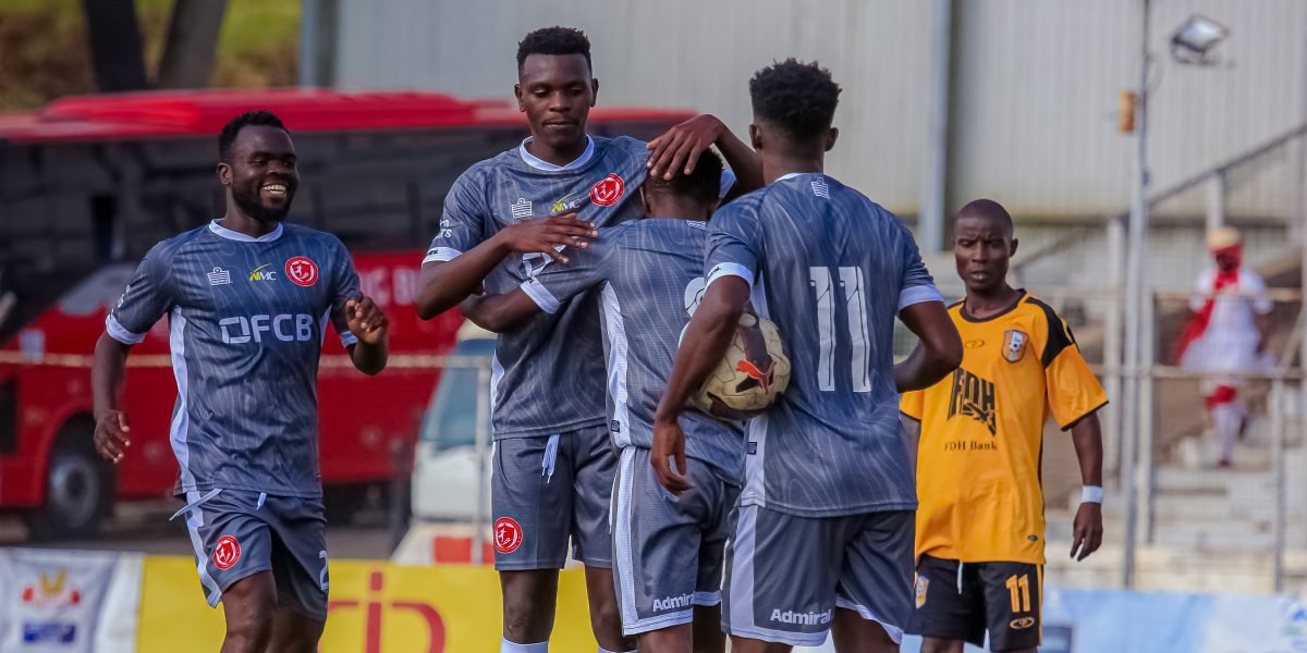 Midfielder Mike Mkwate is mobbed by teammates after scoring Bullets’ second goal against The Boyz FC in the 2025 FDH Bank Cup Round of 16 at Kamuzu Stadium. copy