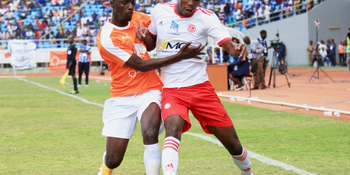 Nyasa Big Bullets forward Hassan Kajoke and Mighty Mukuru Wanderers midfielder Robin Ngalande in the thick of things in the FDH Bank Cup semi-final