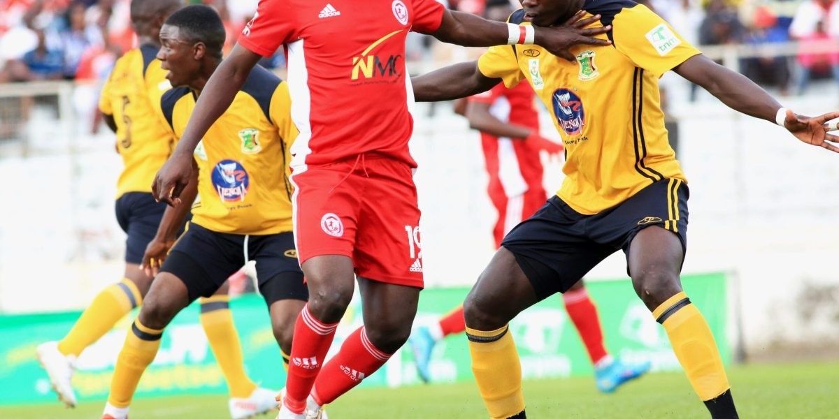 Nyasa Big Bullets forward Lanjesi Nkhoma attempts to beat Kamuzu Barracks defender Herbert Wayekha