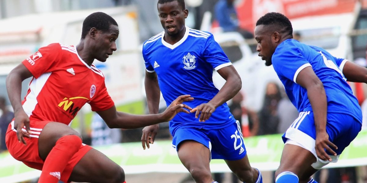Nyasa Big Bullets forward Lanjesi Nkhoma finding his way through Mighty Wanderers defender Ted Sumani