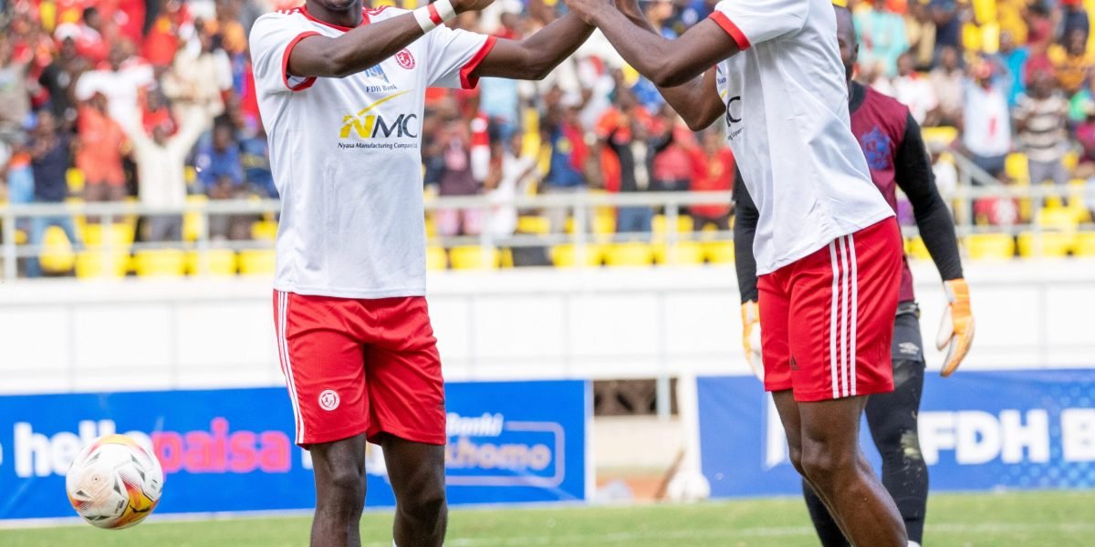 Nyasa Big Bullets fullback Gomezgani Chirwa and midfielder Chimwemwe Idana celebrating the FDH Bank Cup semi-final victory against Mighty Mukuru Wanderers