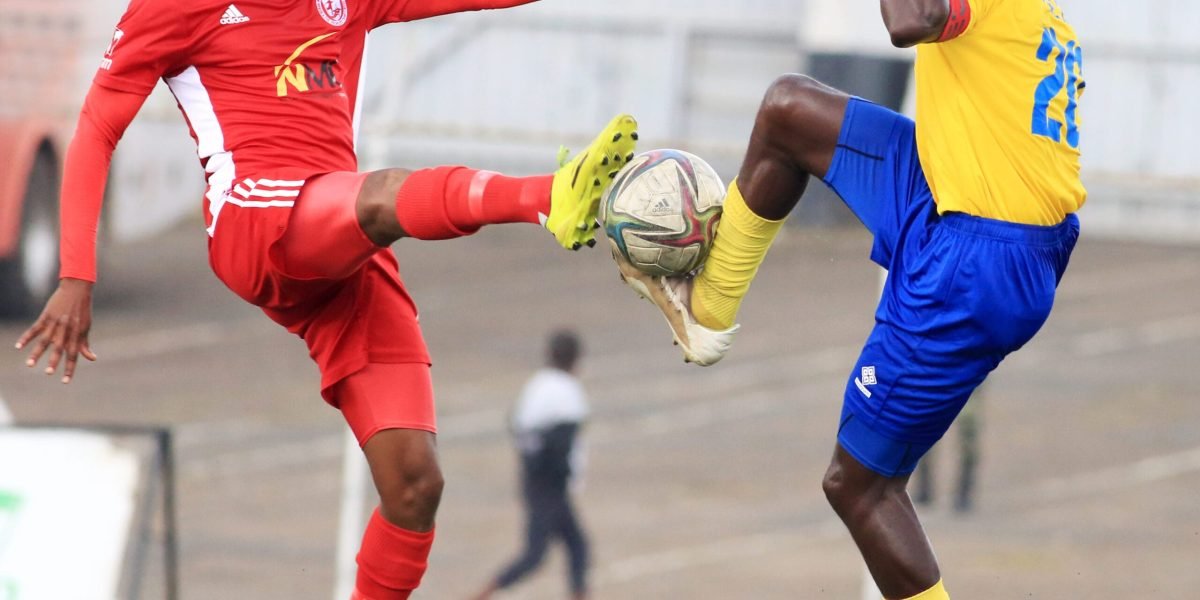 Nyasa Big Bullets midfielder Henry Kabichi against Sable Farming midfilder Innocent Msowoya