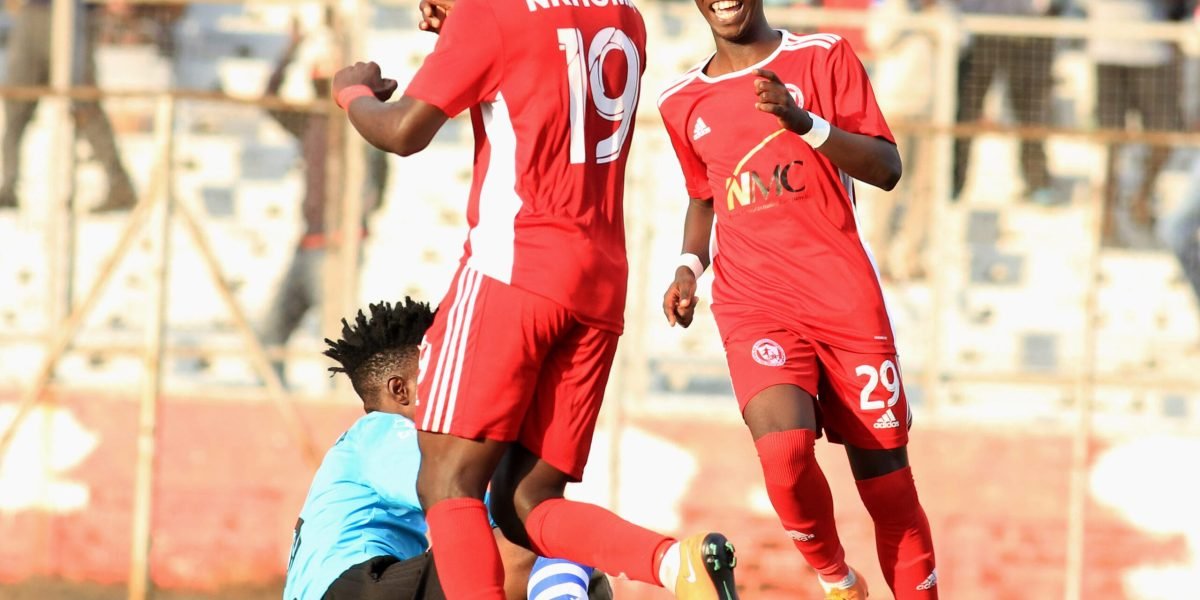 Patrick Mwaungulu and Lanjesi Nkhoma celebrating the former's goal against Mighty Tigers in the TNM Super League