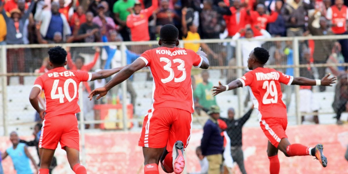 Peter Banda, Ephraim Kondowe and Patrick Mwuangulu celebrating the number 29's winner as FCB Nyasa Big Bullets come from 2-0 down to win 3-2 over Civil Service United