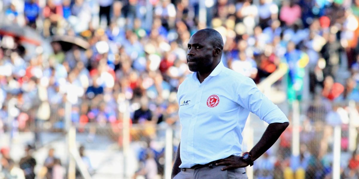Peter Mponda watches from the touchline during the FDH Bank Cup semifinal against Mighty Wanderers at Kamuzu Stadium.