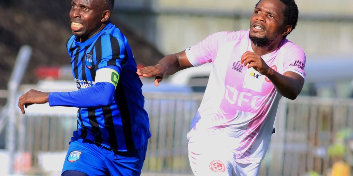 UD Songo Malawian midfielder John Banda against Nyasa Big Bullets midfielder Henry Kabichi in the 2023 Pre-Season International Bonanza at Kamuzu Stadium